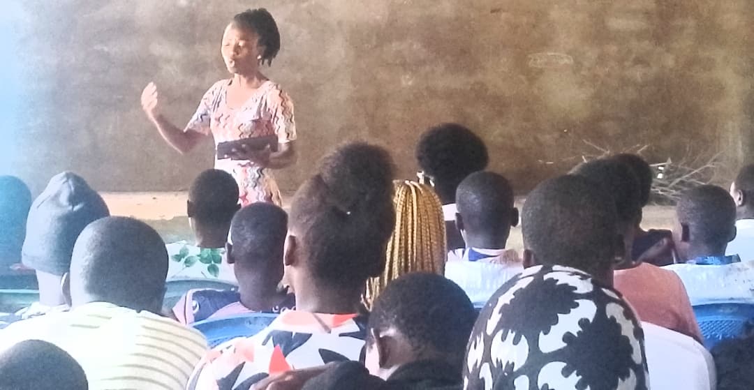 Children in rural Kenya raising their hands